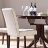 Dining-room-decorating-with-wooden-round-dining-table-and-white-chairs